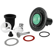 Toilet repair kit components including black plastic valve body, white internal parts, metal stem, springs, and rubber gasket