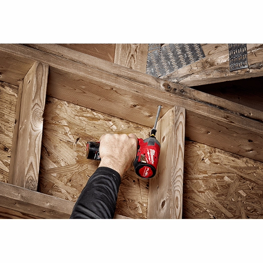 Milwaukee 1/4 inch drive 5/16 inch SAE 6-point deep socket with square drive attachment held in hand.