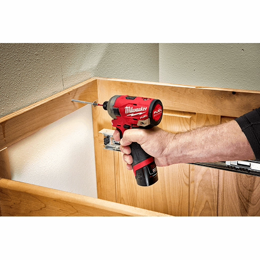 Milwaukee red and black 1/4 inch drive deep socket on wooden surface.