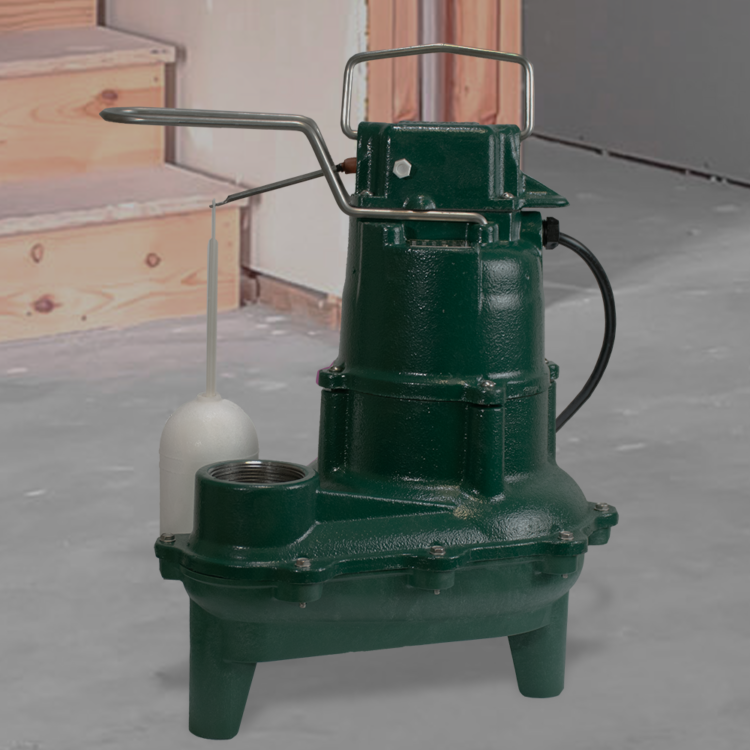 Dark green cast iron sewage pump with handle, outlet port, and white float switch attached to side.