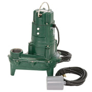 Green cast iron sewage pump with discharge outlet, handle, black power cord, and separate gray switch control unit.
