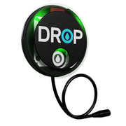 DROP brand leak detector device with black circular face, green indicator light, and attached black cable with connector.