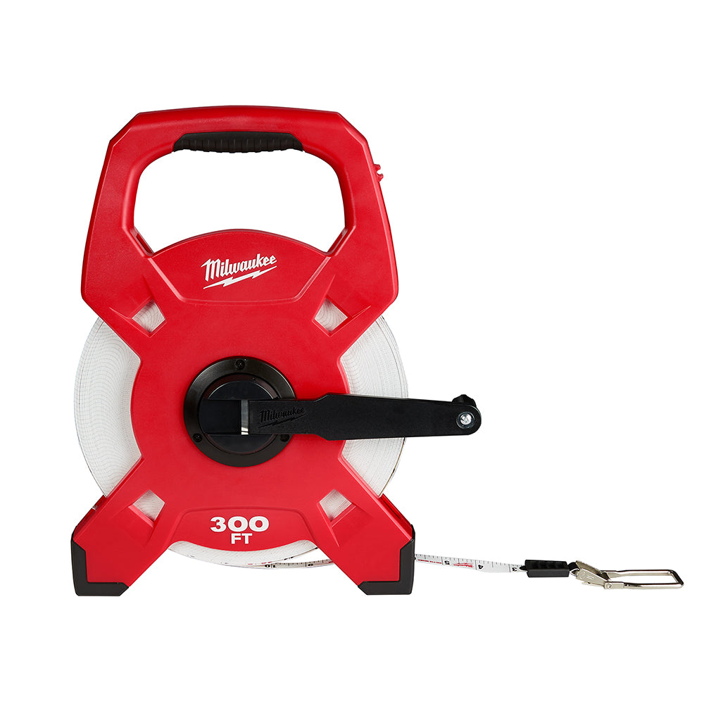 Red fiberglass open reel tape measure with black handle and measuring tape extended from bottom right corner.