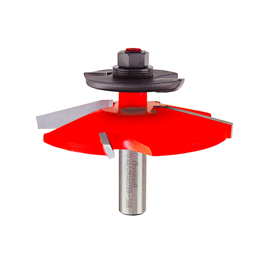 Freud raised panel router bit with red cutting head, gray collar, and backcutters mounted on cylindrical shaft.