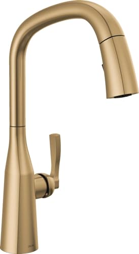 Champagne bronze pull-down kitchen faucet with single lever handle and curved spout.