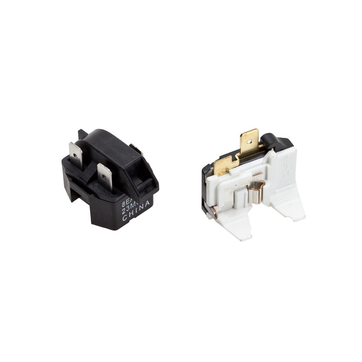 Black and white overload relay components with brass terminals and text marking visible on black unit.