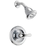 Chrome shower trim with single lever handle, round wall plate, and matching showerhead with spray nozzles.