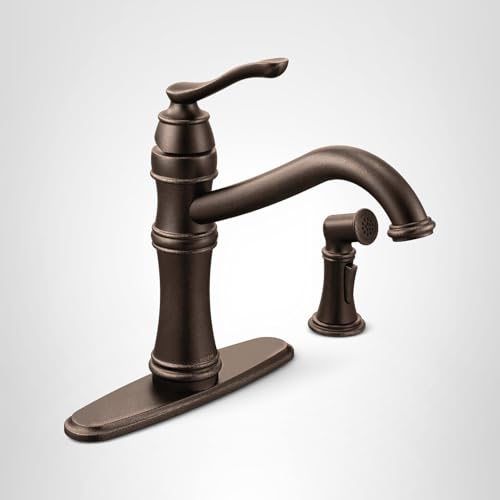 Oil rubbed bronze kitchen faucet with high arc spout, single handle, and matching side spray on oval base plate.