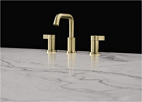 Antique gold three-piece widespread bathroom faucet with tall curved U-spout and cylindrical handles on marble countertop.