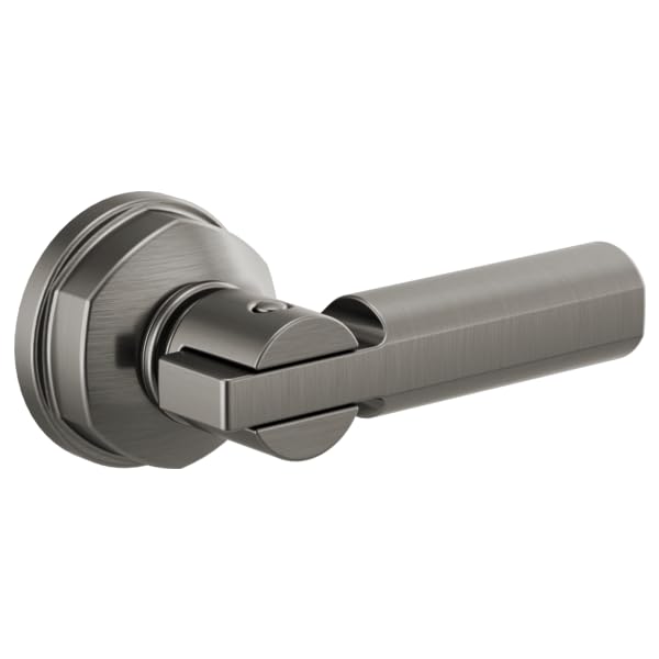 Brushed stainless steel toilet flush lever with rounded handle and circular mounting plate.