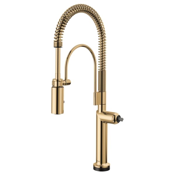 Brass kitchen faucet with flexible coiled hose and pull-down spray head.