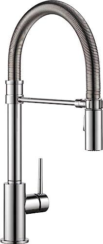 Chrome single-handle pull-down kitchen faucet with coiled spray hose and lever control.