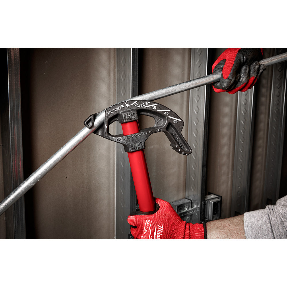 Metal conduit bender with red handle and grip, featuring degree markings on black head, bending 1/2 inch metal conduit.