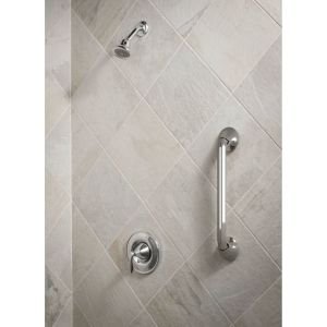 Oil rubbed bronze stainless steel grab bar mounted vertically on tiled bathroom wall.