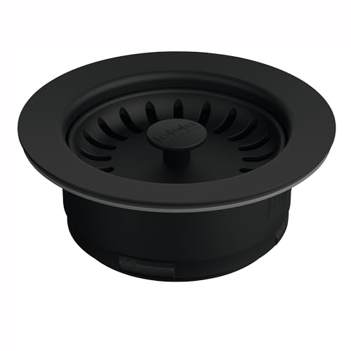Matte black round air switch button with central dome and radiating ridges for garbage disposal activation.