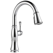 Chrome pull-down kitchen faucet with curved spout, single handle lever, and spray head extended to the right.