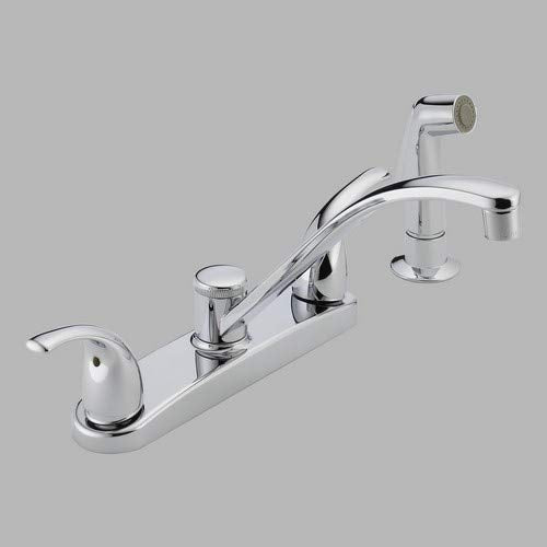 Chrome two-handle kitchen faucet with curved spout, spray head, and matching handles on white base.