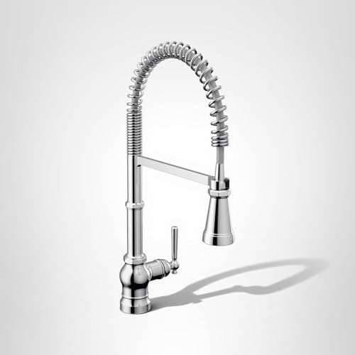 Chrome kitchen faucet with coiled spring pulldown spout and single control handle.