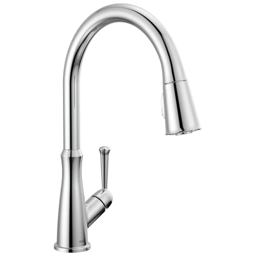 Chrome pull-down kitchen faucet with single lever handle and curved spout.