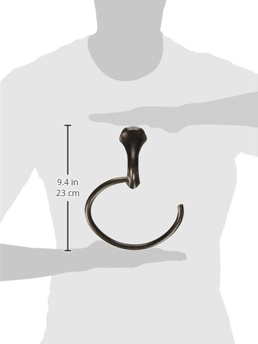Oil rubbed bronze towel ring with mounting bracket, displayed at 9.4 inches height on scale figure.