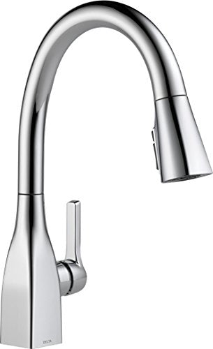 Chrome pull-down kitchen faucet with curved spout and single handle control lever.