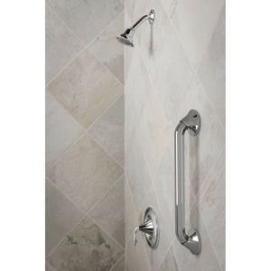 Brushed nickel stainless steel grab bars installed vertically and horizontally on a marble tile bathroom wall.