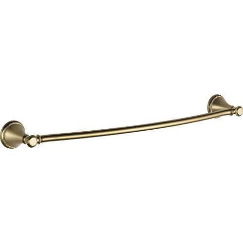 Brass-finish towel bar with decorative circular wall mounts on each end.