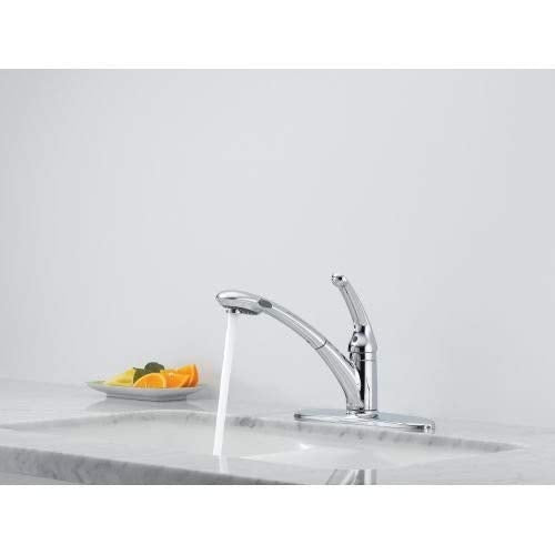 Chrome single-handle pull-out kitchen faucet with lever control and water stream active over sink.