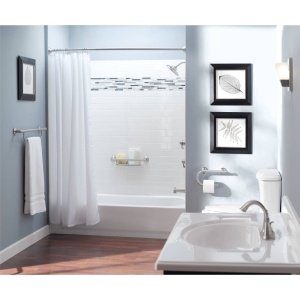 Chrome grab bar with integrated shelf mounted above white bathtub in bathroom with shower curtain.