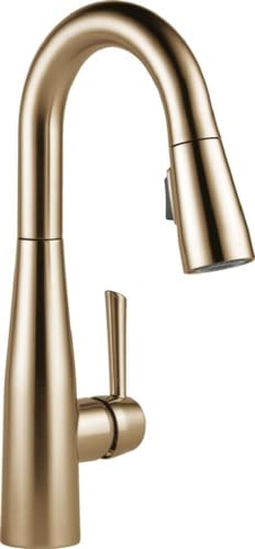 Champagne bronze single-handle pull-down kitchen faucet with curved spout and side lever.