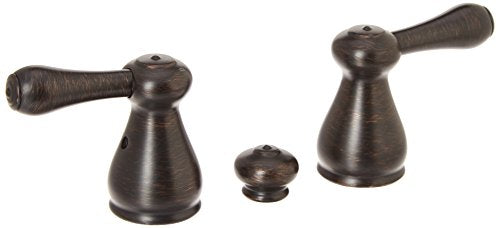 Two Venetian bronze lever handles with conical bodies and textured handles, shown with matching valve cap.