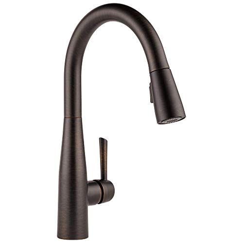 Oil-rubbed bronze kitchen faucet with curved spout and pull-down sprayer head.