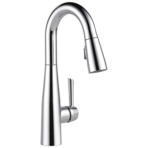 Chrome pull-down kitchen faucet with single handle and curved spout.