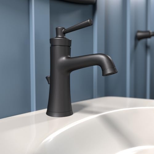 Matte black single-hole bathroom faucet with curved spout and lever handle installed on white sink.