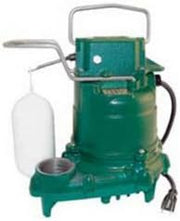 Green and gray Zoeller M57 submersible sump pump with handle and white collection basin attached.