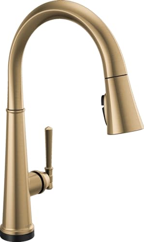 Champagne bronze single-handle kitchen faucet with tall curved spout and pull-down spray head.