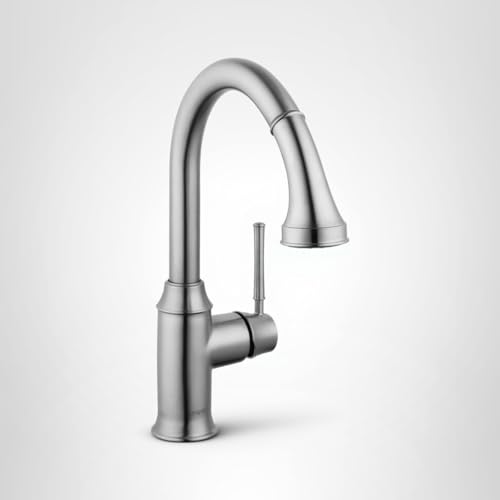 Steel kitchen faucet with curved spout, pull-down sprayer head, and single lever handle.