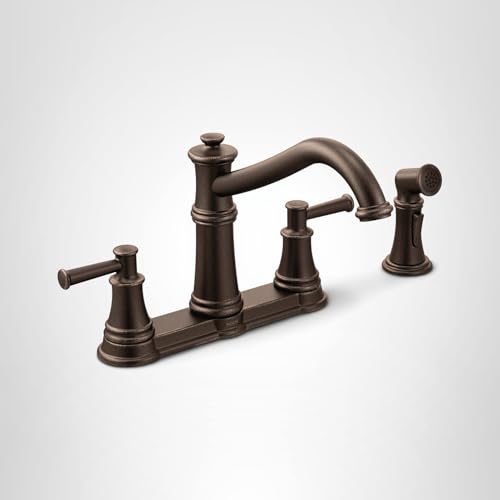 Oil-rubbed bronze two-handle kitchen faucet with high arc spout and detachable side spray on base deck.