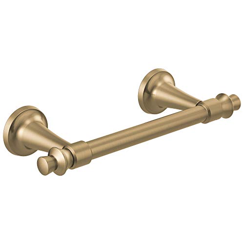 Brass pivoting tissue holder with round wall-mounted flanges and cylindrical bar, featuring a small rotating knob on the unde