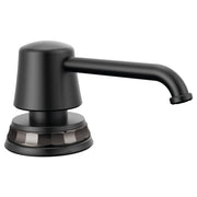 Matte black soap/lotion dispenser with cylindrical pump head and curved spout on circular base.