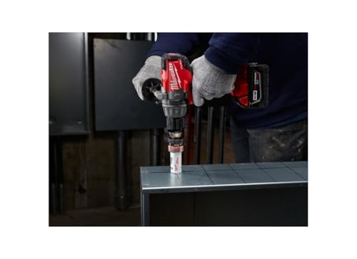 Milwaukee cordless drill with hole saw attachment drilling through metal sheet.
