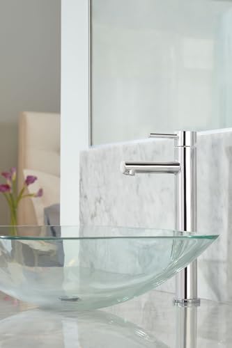 Chrome single-handle faucet with curved spout mounted on glass vessel sink with marble backsplash.