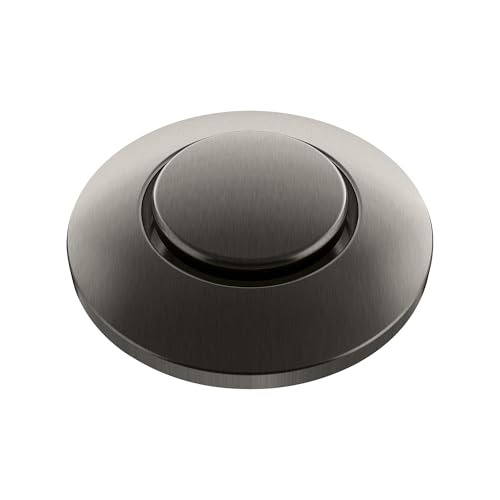 Satin dark steel air switch with round trim plate and raised center button.