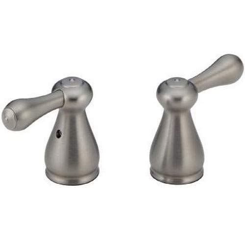 Pair of stainless steel bathroom faucet handles with lever arms and conical bases.
