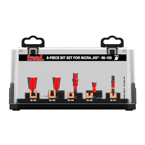 Eight router bits with red and black handles in a clear plastic case labeled Freud 96-100 8-piece bit set for Incra jig.