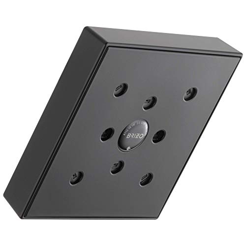 Square matte black shower head with multiple circular spray nozzles arranged around center control button mounted on wall.