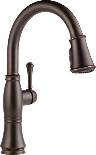 Oil-rubbed bronze kitchen faucet with high curved spout, single handle, and pull-down spray head.