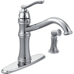 Chrome kitchen faucet with high arc spout, single handle, and matching side spray attachment on base plate.