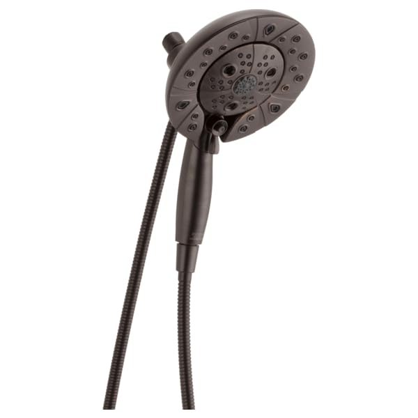 Round dark gray shower head with multiple spray jets and attached flexible hose with handheld sprayer.