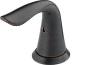 Curved metal lever handle in dark Venetian bronze finish with round base and mounting hole.